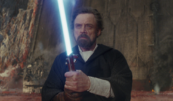 luke holding a lightsaber on crait luke holding a lightsaber on crait