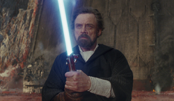 luke holding a lightsaber on crait