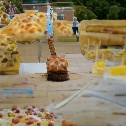 There's a brick building and trees in the background and it looks like heaps of giraffe-spotted dough about two stories high. In the foreground is a muffin shaped object with a very tall giraffe-spotted neck.