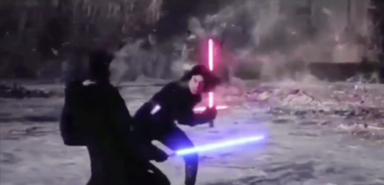 mid-fight, with luke and kylo dodging around each other mid-fight, with luke and kylo dodging around each other