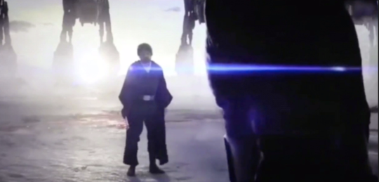 luke standing facing kylo, with at-ats in the backgrounnd