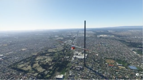 A plane flies toward a 212-story building rising above the otherwise flat city of Melbourne. It would be unremarkable as a real photo if not for the uncanny monolith.