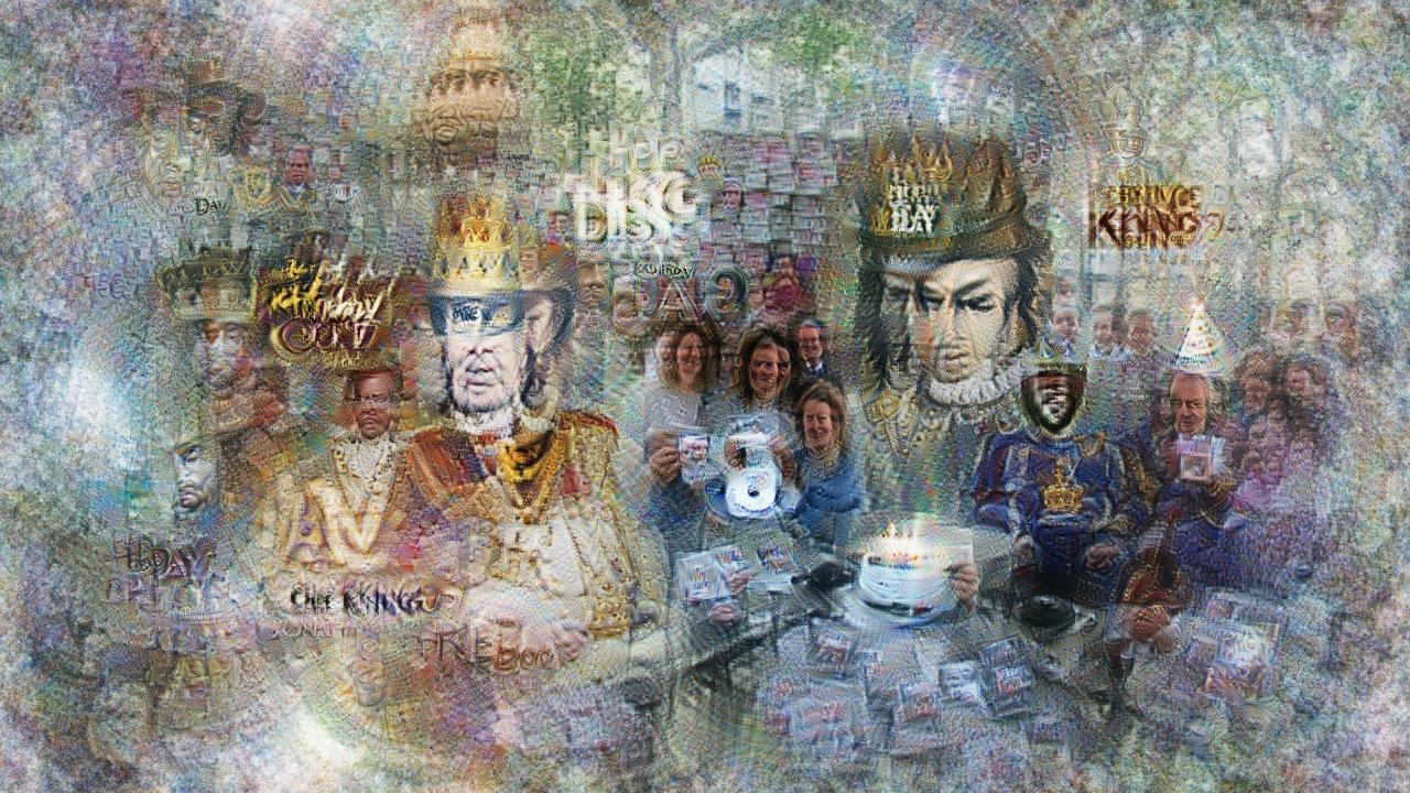 Many copies of a person in ruffled collar and crown, surrounded by smiling crowds in more ordinary gear. There is a cake with lit candles, and also a single shining CD. Many copies of a person in ruffled collar and crown, surrounded by smiling crowds in more ordinary gear. There is a cake with lit candles, and also a single shining CD.